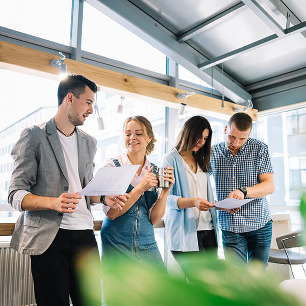 coworkers working plans break