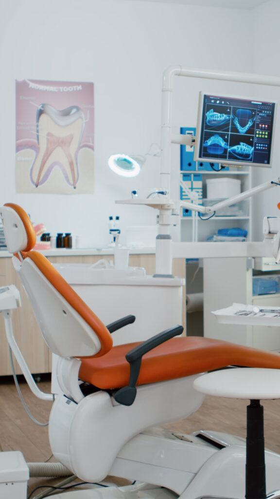 interior of dentist stomatology orthodontic office with teeth radiography on monitor.